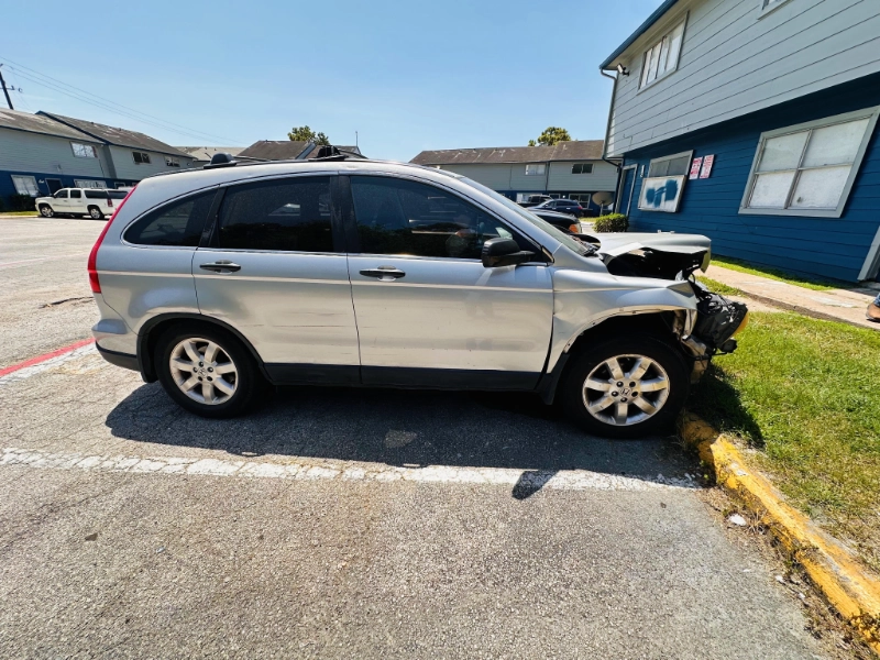 Silver damaged Honda CR-V parked at an apartment complex in Channelview, TX.