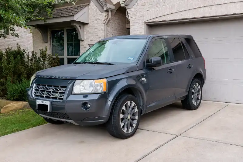 Gray Land Rover parked in a residential driveway in Seabrook, TX.