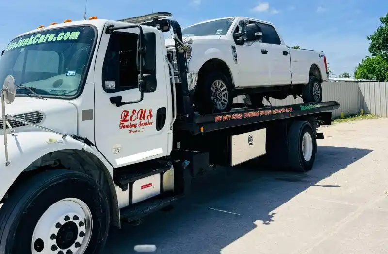 Zeus Cash For Junk Cars tow truck picking up a junk car for cash in Jersey Village, TX